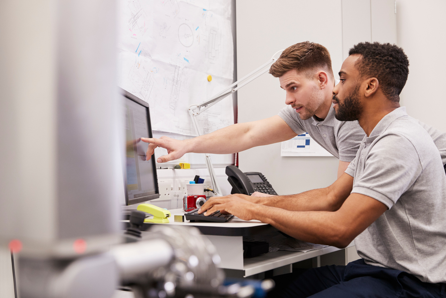 Male Engineers Use Coordinate Measuring Machine 